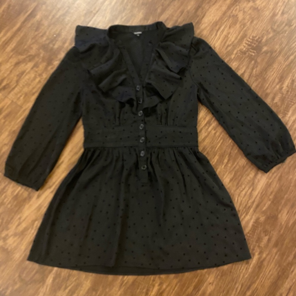 Woman’s black minidress